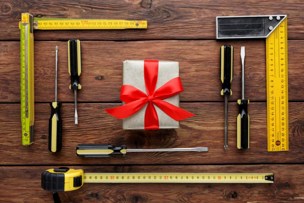 Happy Fathers Day background, card on rustic wood with repair tools and other man things, top view