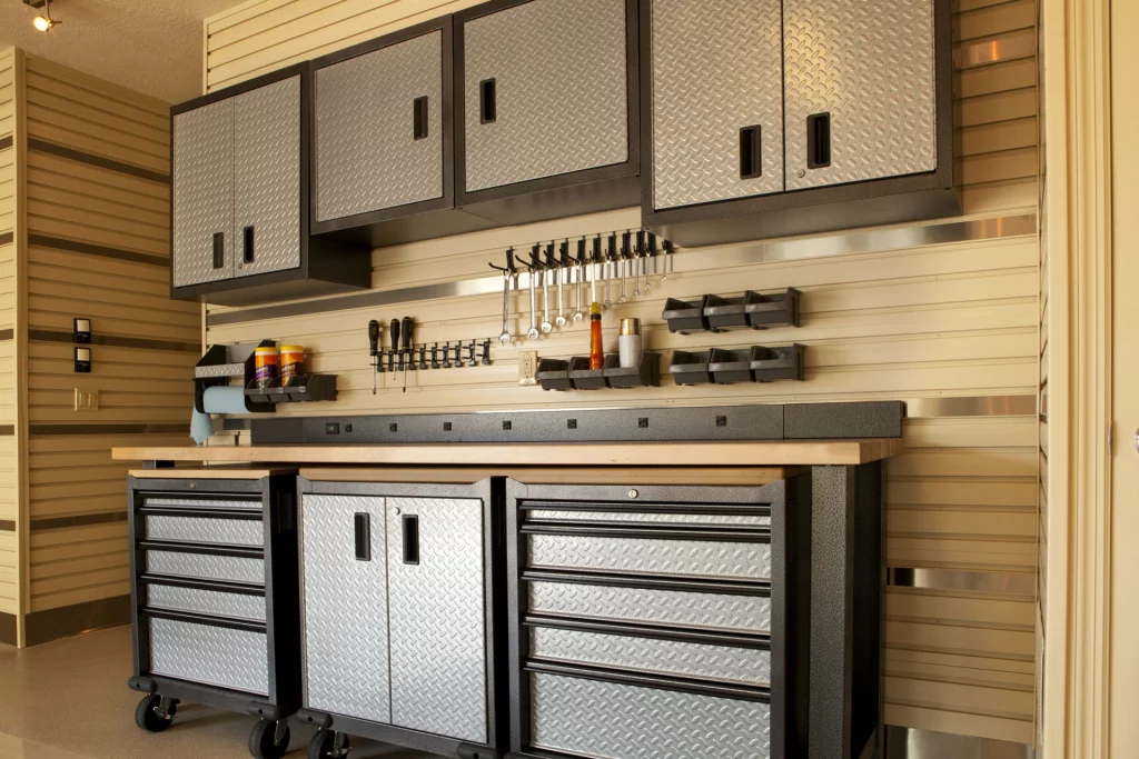 "Garage workspace with cabinets, countertop and tools"