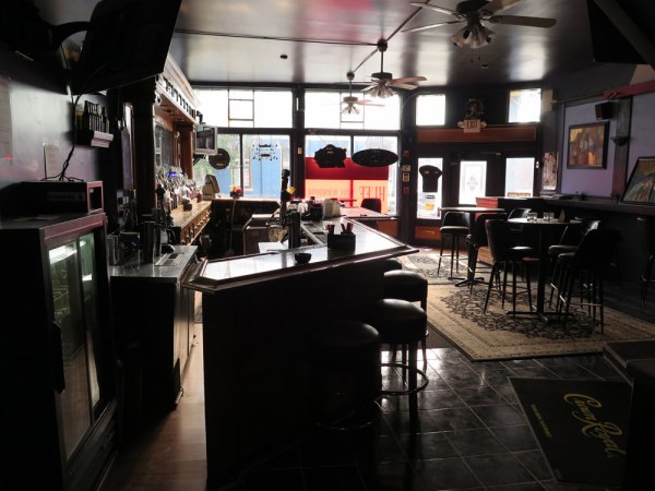 A view of the interior of the current bar. We will keep the vintage bar on the left. The black paint and tile will be replaced.