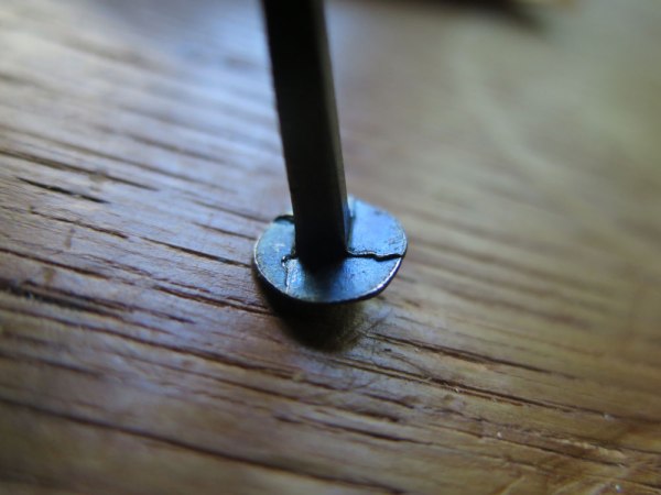 The curious underside of the head of a "forgery."