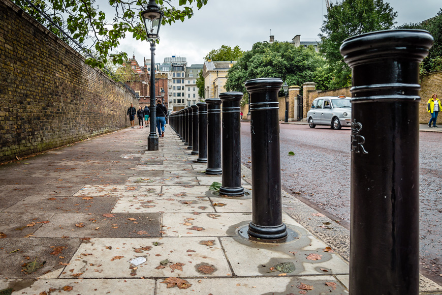 A row of bollards along the street