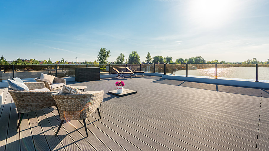 A view from a large deck overlooking a lake