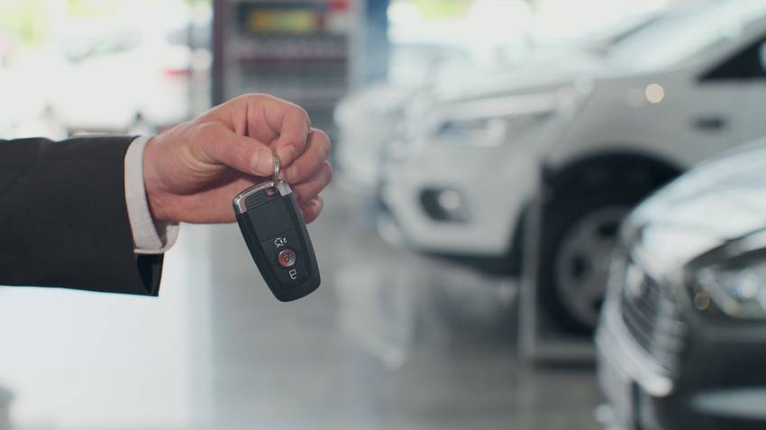 car key fob in front of cars