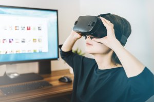 A woman wearing VR glasses